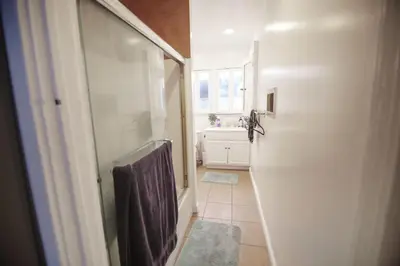 a bathroom with a walk in shower and a sink at Cozy room in East Holywood, 7 min from holllywood, 15 from downtown, 20 to hollywood sing in Los Angeles