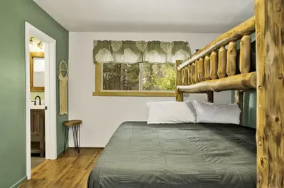 a bedroom with a bunk bed and a window at Arlberg Village Haus Game Room Walk to the Slopes in Big Bear Lake