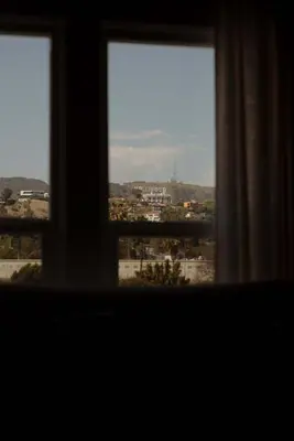 a view of a city from a window at The Hollywood Sign Lookout in Los Angeles