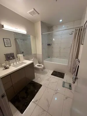 a bathroom with a sink and a tub and a toilet at Luxury 2BR Apt with balcony!! in Los Angeles