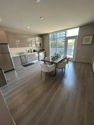 a kitchen with a table and chairs in a room at Luxury 2BR Apt with balcony!! in Los Angeles