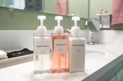 two bottles of bathroom products sitting on a bathroom counter at The Quirky Bloom-Whimsical Guest house in Upland