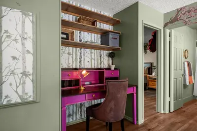 a pink desk with a chair in a room at The Quirky Bloom-Whimsical Guest house in Upland