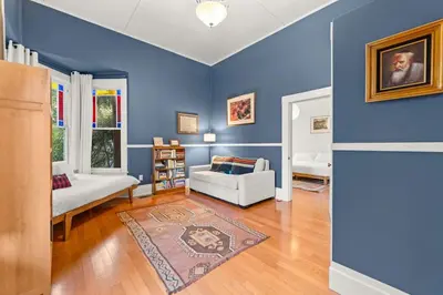 a living room with blue walls and a couch at Sea View, Sauna, Hot Tub, Beach Bikes, Stream in Ventura
