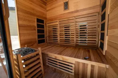 a sauna with wooden walls and a wooden floor at Sea View, Sauna, Hot Tub, Beach Bikes, Stream in Ventura