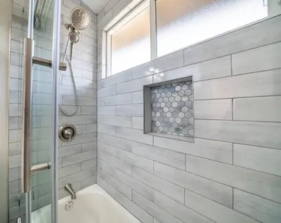 a bathroom with a tub and a shower with a window at Imagination Kingdom by OC Adventure Homes in Garden Grove