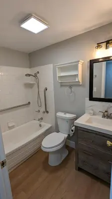 a bathroom with a toilet and a tub and a sink at Serene home in Simi valley, CA in Simi Valley