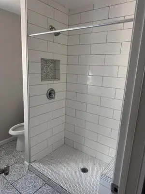 a bathroom with a shower stall with a toilet at LRG 1600sqft 4room 2 bath in a quiet neighborhood in Bakersfield