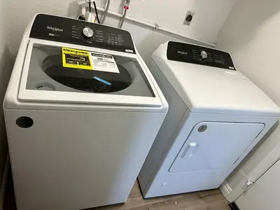 a stove and a washer and dryer in a room at Modern Private 3B-2BA Home and Spacious Yard in Lancaster
