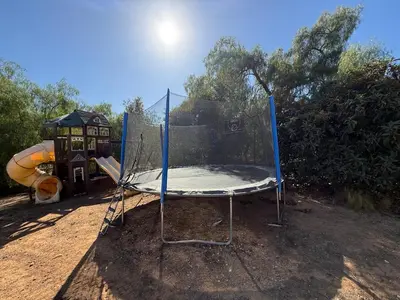 a swing set in a park with a playground at Paradise at Tree Ranch Grove in Ojai