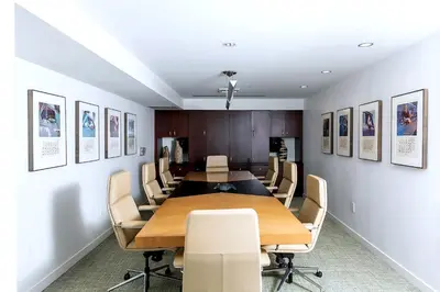 a conference room with a long table and chairs at Platinum Suites - Gym & Pool & Hot Tub & BBQ in Los Angeles