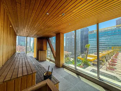 a room with a wooden table and large windows at Stylish 2BR Loft with Top-Tier Amenities - 104 - GL in Glendale