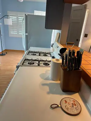 a kitchen counter with a stove and a knife block at 3-Bedroom Luxury Villa Near Dodger Stadium, Downtown LA Free Parking in Los Angeles