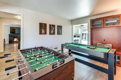 a living room with a pool table at Beautiful Lake-View House Walk to Lake and Village! in Big Bear Lake