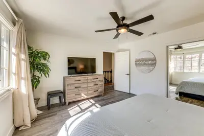 a bedroom with a bed and a ceiling fan at Beautiful Lake-View House Walk to Lake and Village! in Big Bear Lake