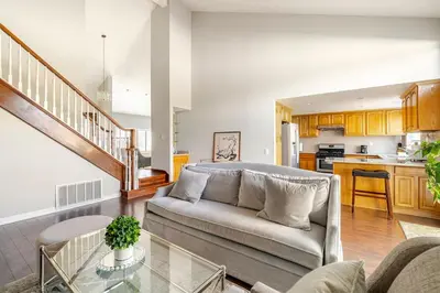 a living room with a couch and a kitchen at Spacious 4-bedroom family house-20 mins to Disney Land in Rowland Heights