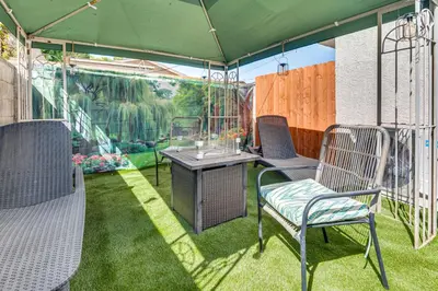 a patio with chairs and a table in a tent at Near Hospitals and Metrolink Access LA Getaway in Los Angeles