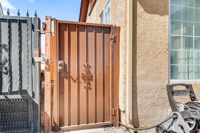 a gate on the side of a building at Near Hospitals and Metrolink Access LA Getaway in Los Angeles