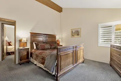 a bedroom with a bed and a dresser and a mirror at Summit Ski Resort Mountain View Condo - Walk to Snow Summit in Big Bear Lake