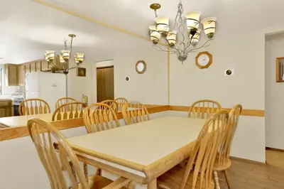 a kitchen and dining room with a table and chairs at Summit Ski Resort Mountain View Condo - Walk to Snow Summit in Big Bear Lake