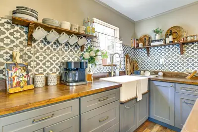 a kitchen with blue cabinets and a counter top at Hike, Ski, Relax Mtn Getaway in Lake Arrowhead in Lake Arrowhead