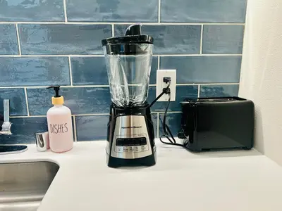 a blender sitting on a counter next to a toaster at Heart of Hollywood Walk of Fame - Free Parking, Pool, Gym, Rooftop Views, centrally located, WIFI in Los Angeles