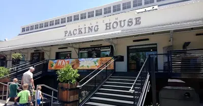 a building with people walking outside of a rocking house at Luxury Stay Near Disneyland With Pool Gym & Free Parking in Santa Ana