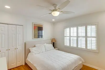 a bedroom with a bed and a ceiling fan at Less Than 1 Mi to Universal Studios Home with Private Pool in Los Angeles