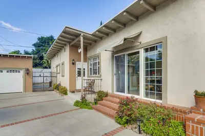 a house with a patio and a fence at Less Than 1 Mi to Universal Studios Home with Private Pool in Los Angeles