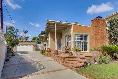 a house with a patio in front of it at Less Than 1 Mi to Universal Studios Home with Private Pool in Los Angeles