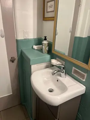 a bathroom with a sink and a mirror at The Magic castle Unit 1-2 in Santa Clarita