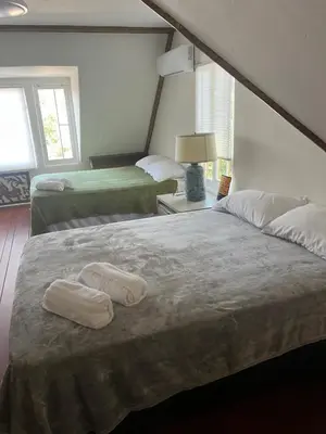 a bedroom with two beds with towels on it at The Magic castle Unit 1-2 in Santa Clarita