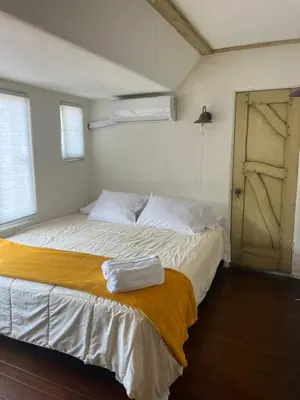 a bedroom with a bed and an open door at The Magic castle Unit 1-2 in Santa Clarita