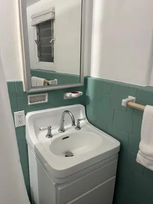 a bathroom with a sink and a mirror at The Magic castle Unit 1-2 in Santa Clarita