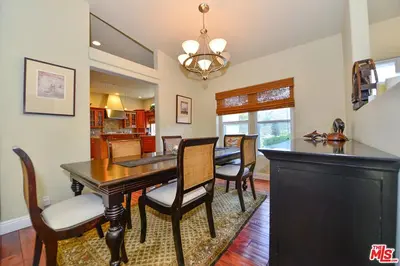 a dining room with a black table and chairs at Beautiful, Spacious Agoura Malibu Zen House in Agoura Hills