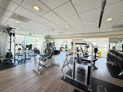 a gym with treadmills and machines in a room at Relax and recharge in this elegant 2BR loft - 108 - GL in Glendale