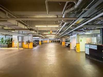 an empty parking garage with cars parked in it at Relax and recharge in this elegant 2BR loft - 108 - GL in Glendale