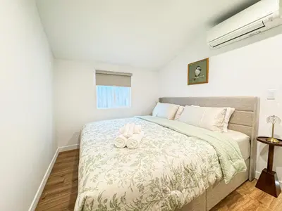 a bedroom with a bed with two towels on it at Cozy Designer Guesthouse with Style - RE in Calabasas