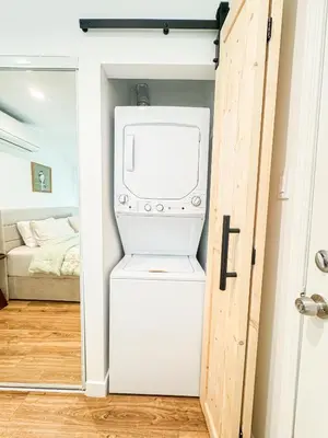 a washer and dryer in a room with a door at Cozy Designer Guesthouse with Style - RE in Calabasas
