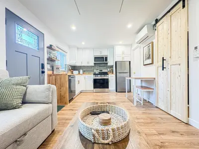a living room with a couch and a table at Cozy Designer Guesthouse with Style - RE in Calabasas
