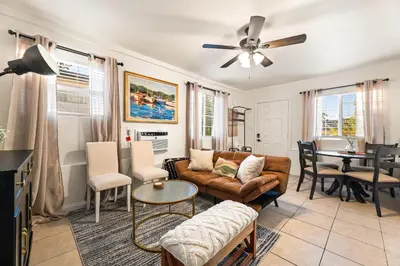 a living room with a couch and a table at Echo Park Spacious Two-Bedroom Apartment with Private Yard and Parking in Los Angeles