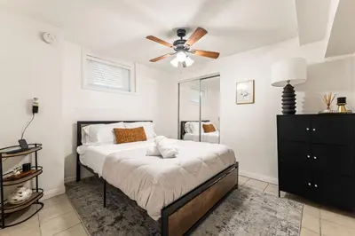 a bedroom with a bed and a ceiling fan at Echo Park Spacious Two-Bedroom Apartment with Private Yard and Parking in Los Angeles