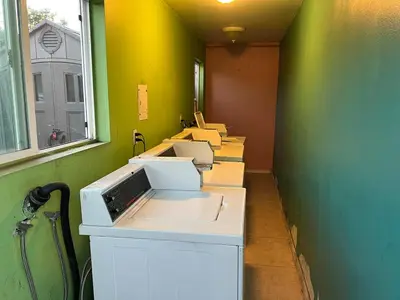 a row of empty desks in a room with a window at 9621 San Juan - South Gate CA - Quick Drive to Hollywood & Beaches in South Gate