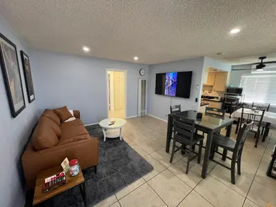 a living room with a couch and a table at 9621 San Juan - South Gate CA - Quick Drive to Hollywood & Beaches in South Gate