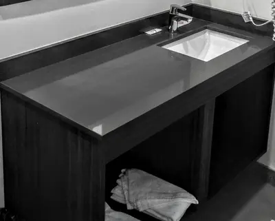 a counter with a sink in a bathroom at Jewel City Inn in Glendale