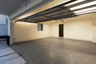 an empty parking garage with a door in it at Spacious Luxury Villas in the heart of LA! Free parking and Jacuzzi in Los Angeles