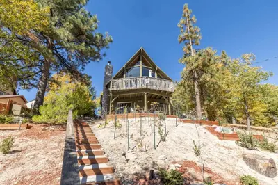 a house on top of a hill with trees at The Great Escape Beach Access, Near Slopes, View in Lake Arrowhead