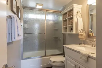 a bathroom with a shower and a toilet and a sink at The Great Escape Beach Access, Near Slopes, View in Lake Arrowhead