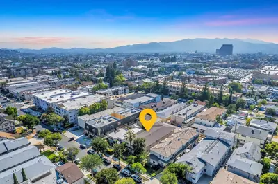 an overhead view of a city with a yellow arrow at Luxury 2BR Apartment Great Area with Parking in Glendale