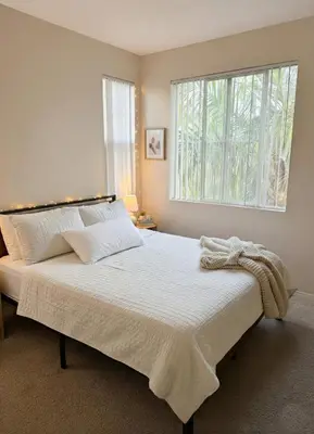 a bedroom with a large bed with a window at 1BR Luxury Apartment - Luxury Resort Amenities in Los Angeles